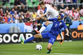 Czech Republic forward Milan Skoda (in white) challenges Croatia's Vedran Corluka for the ball during their Euro 2016 clash.