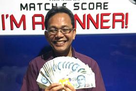 HAPPY: Taxi driver Wari Ismail, who turns 58 tomorrow, won $2,100 in the TNP Match &amp; Score contest yesterday.