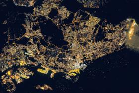 SO BRIGHT: A satellite picture of Singapore (above) taken on March 17. 