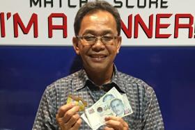 ALL SMILES: Mr Wari Ismail (above) and Mr Loke Kok Kean won $100 each yesterday.