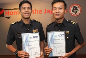 PROUD: Mr Hairil (left) and Mr Adhwa (right) with their Public Spiritedness awards. 