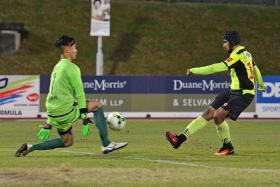 IN-FORM FAZRUL: Tampines Rovers&#039; Fazrul Nawaz (right) restoring their lead by slotting past Global FC&#039;s goalkeeper Patrick Deyto.