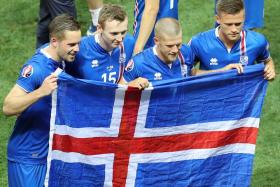 Iceland players celebrate after beating England at Euro 2016.