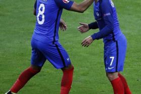 Antoine Griezmann (right, scoring France’s fourth goal).