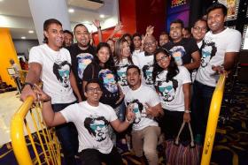 DEVOTED: A group of 30 childhood friends and die-hard fans of Rajinikanth sported matching Kabali T-shirts. With them is Ms Renu Ananthan, 31, (centre, in black) who braved the crowds despite being eight months pregnant.