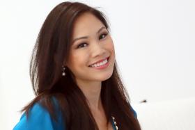 BEAUTY AND BRAINS: Miss Cheryl Tay (above), a vet, was crowned Miss Singapore Universe 2005. She also won the Miss Personality in the same contest.