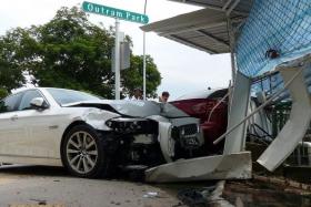 CRASH: A red Mitsubishi was making a right turn at Outram Park when it collided with a BMW (above).