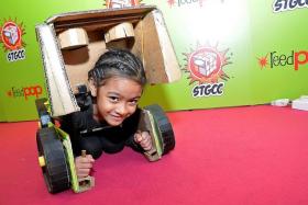 CUTE: Nur Nyla Qamelia, eight, had a Bumblebee outfit. The Transformer character get-up was put together by her father and it allowed her to turn into a car like her character. 