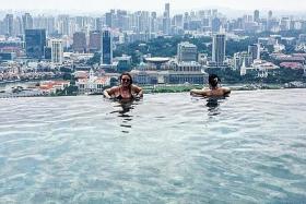 TACTIC: Tourist Emma Balmforth took bathrobes and slippers from a housekeeping cart to pass off as a hotel guest at Marina Bay Sands.