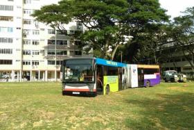 SURPRISE: Toa Payoh residents woke up to the odd sight of a bus in the middle of a large field after its wheels were trapped in the soft soil.