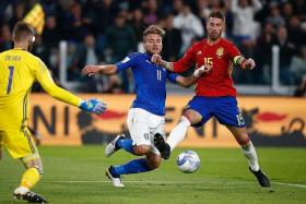 POOR FORM: Spain captain Sergio Ramos (No. 15, tackling Italy striker Ciro Immobile) has given away three penalties in just nine games for Real Madrid this season. The penalty he conceded against Italy yesterday morning makes it four. 