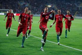 GOAL MACHINE: With his four-goal feat against Andorra, Cristiano Ronaldo (centre, No. 7) takes his Portugal career tally to 65 goals in 134 appearances.