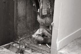 GRISLY: The worker was found injured in a rubbish chute at the ground floor of Block 8, Jalan Rumah Tinggi. 
