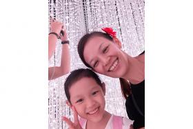DEVOTED MUM: Madam Ng Cher Khee (right) and with her daughter Ashlyn Soh Yu Xuan (left). 
