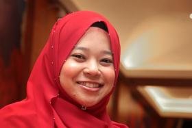 FOCUSED: Madam Nur Faezah Abdul Rahman, a teacher at Cerebral Palsy Alliance Singapore School, has never thought of teaching in a mainstream school. 