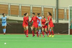 TOP OF THEIR GROUP: China (in red) will aim for a repeat in the final after beating India last night.