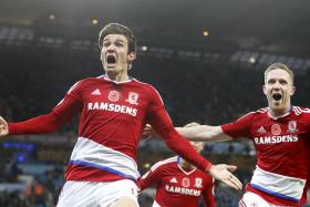 DRAMATIC EQUALISER: Marten de Roon&#039;s (left) late header gives Middlesbrough a point against Manchester City.