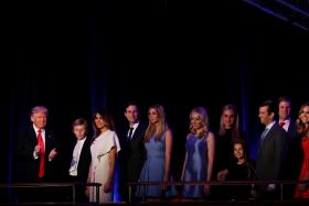 TRIUMPHANT: Mr Donald Trump and his family at his election night event at the New York Hilton Midtown hotel. 