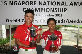 ALL SMILES: The winners of the 17th SNAC, Lucius Toh (left) and Margaret Fernandez, posing with their trophies.  