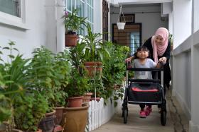 DETERMINED: There is no cure for Hereditary Spastic Paraplegia, but Qatrina Yusri walks to strengthen her legs. 