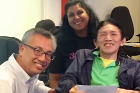 BIM Studio Manager Timothy Ang, 61, (right), received a cheque on behalf of the Disabled People&#039;s Association from Mr Yong Fook Chyi, director (corporate services) of Tote Board. Looking on is 
Advocacy Consultant Asha Karen. 