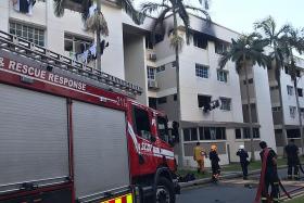 Man rescued from ledge while fleeing from fire