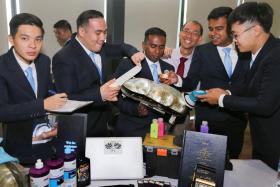 Mr Dunstan Richard Thomasz (second from left) and Mr Joel Kirubairaj Mohan Job (third from left) at the Industry Engagement Day. PHOTO: THE STRAITS TIMES