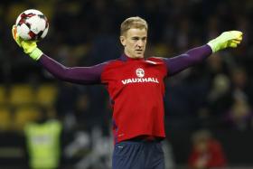 England&#039;s Joe Hart warms up before the match against Germany