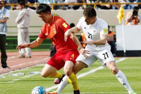 Iran&#039;s Vorya Ghafuri (R) in action against China&#039;s Jiang Zhipeng (L) during the World Cup qualification soccer match between Iran and China at the Azadi stadium in Tehran