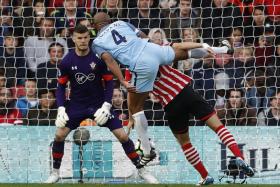 Manchester City&#039;s Vincent Kompany scores their first goal