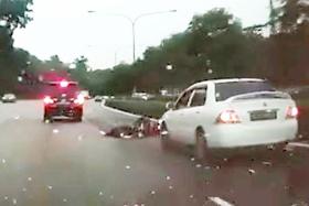 Motorcyclist hit by two cars, dragged for several metres