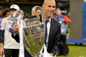  Zinedine Zidane celebrates with the trophy after the UEFA Champions League final 