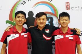  (L to R) Cadet doubles paddler Pang Yew En Koen, coach Dong ShiFei and cadet doubles paddler Dominic Koh after they clinched the Cadet Doubles Gold medal at the SEA Junior and Cadet Table Tennis Championships. 
