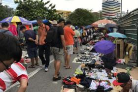 Visitors and stall holders at the last weekend of Singapore&#039;s oldest flea market, the Sungei Road Market.