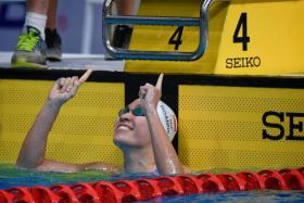 Swimmer Roanne Ho celebrates after winning the SEA Games women's 50m breaststroke final.