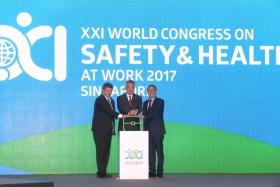 Prime Minister Lee Hsien Loong, International Labour Organisation director-general Guy Ryder (far left) and International Social Security Association president Joachim Breuer launch the 21st World Congress on Safety and Health at Work on Sept 3, 2017. 