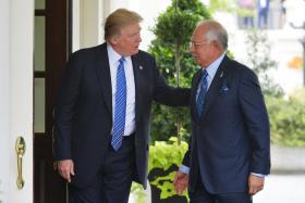 Mr Donald Trump greeting Mr Najib Razak at the White House on Tuesday. 
