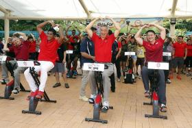 PM Lee, residents pedal hard to donate brown rice to charities