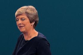 May has backing of senior ministers despite rebellion