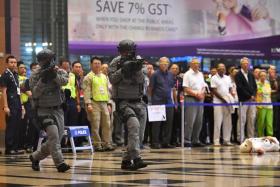 Police specialist officers responding to the “threat” at Terminal 3. 