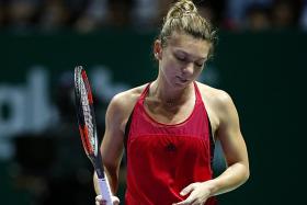 Halep crashes out of WTA Finals