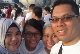 Singapore General Hospital nurse clinician Nadrah Hamzah (left) with friends during the 2014 Big Walk.