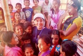 Ms Lakhvinder Kaur (middle) with the refugee children at Gundam refugee camp.
