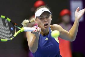 Caroline Wozniacki has lost for the first time since winning the Australian Open title last Saturday.