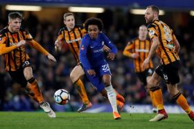 Chelsea&#039;s Willian (in blue) could have had a hat-trick, but saw an effort come back off the post two minutes from time.
