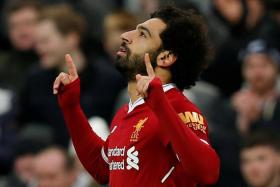 Liverpool's Mohamed Salah, a devout Muslim, is often seen kneeling in prayer after scoring.