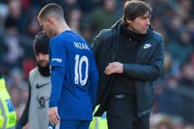 Antonio Conte (left, with Eden Hazard) is hoping to lift his charges after losing 2-1 to Manchester United in their last match.