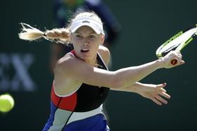 Caroline Wozniacki (above) had won the first set against Monica Puig 6-0, but then lost the next two 6-4 6-4 amid alleged verbal abuse from fans at the Miami Open.