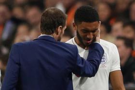 Liverpool&#039;s Joe Gomez (right) getting consoled by England manager Gareth Southgate after going off injured during last week&#039;s international friendly against Holland.