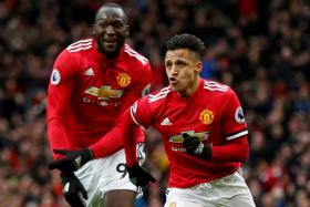Manchester United&#039;s Alexis Sanchez celebrating with Romelu Lukaku after scoring the second goal.